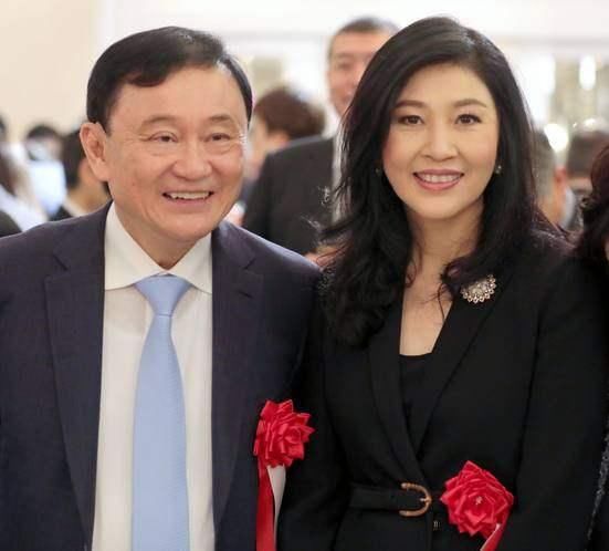 他信在日参加酒会,英拉在英国申请政治庇护成