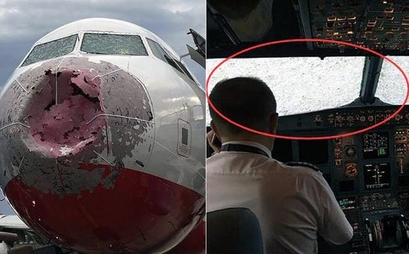 客机高空遭冰雹袭击 机头被砸扁