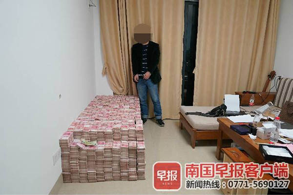 广西破获8亿元特大传销案 4700万现金铺满床(图) 广西破获8亿元特大传销案 4700万现金铺满床(图)